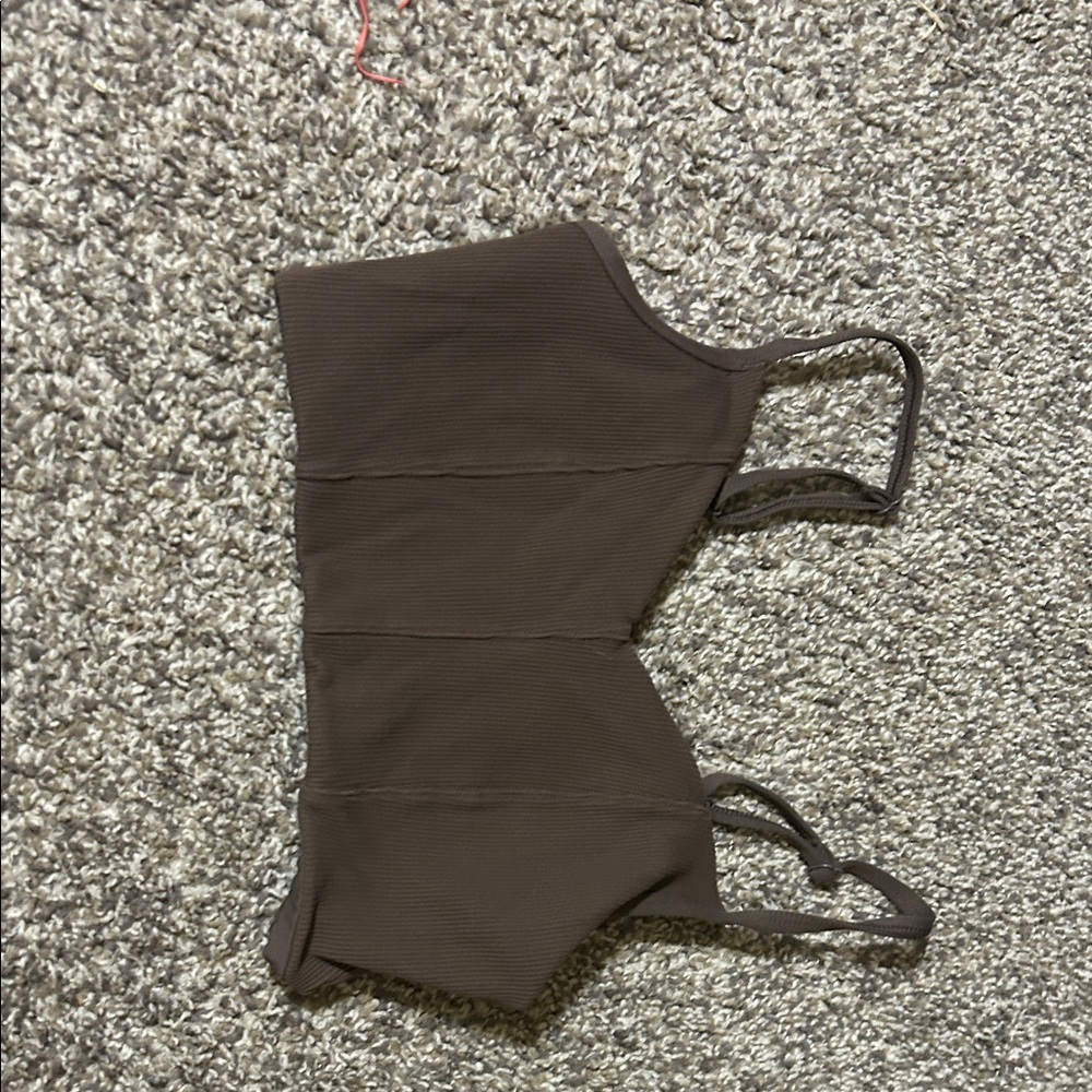 Brown athletic crop top. Crop hight is a little lower than a sports bra.